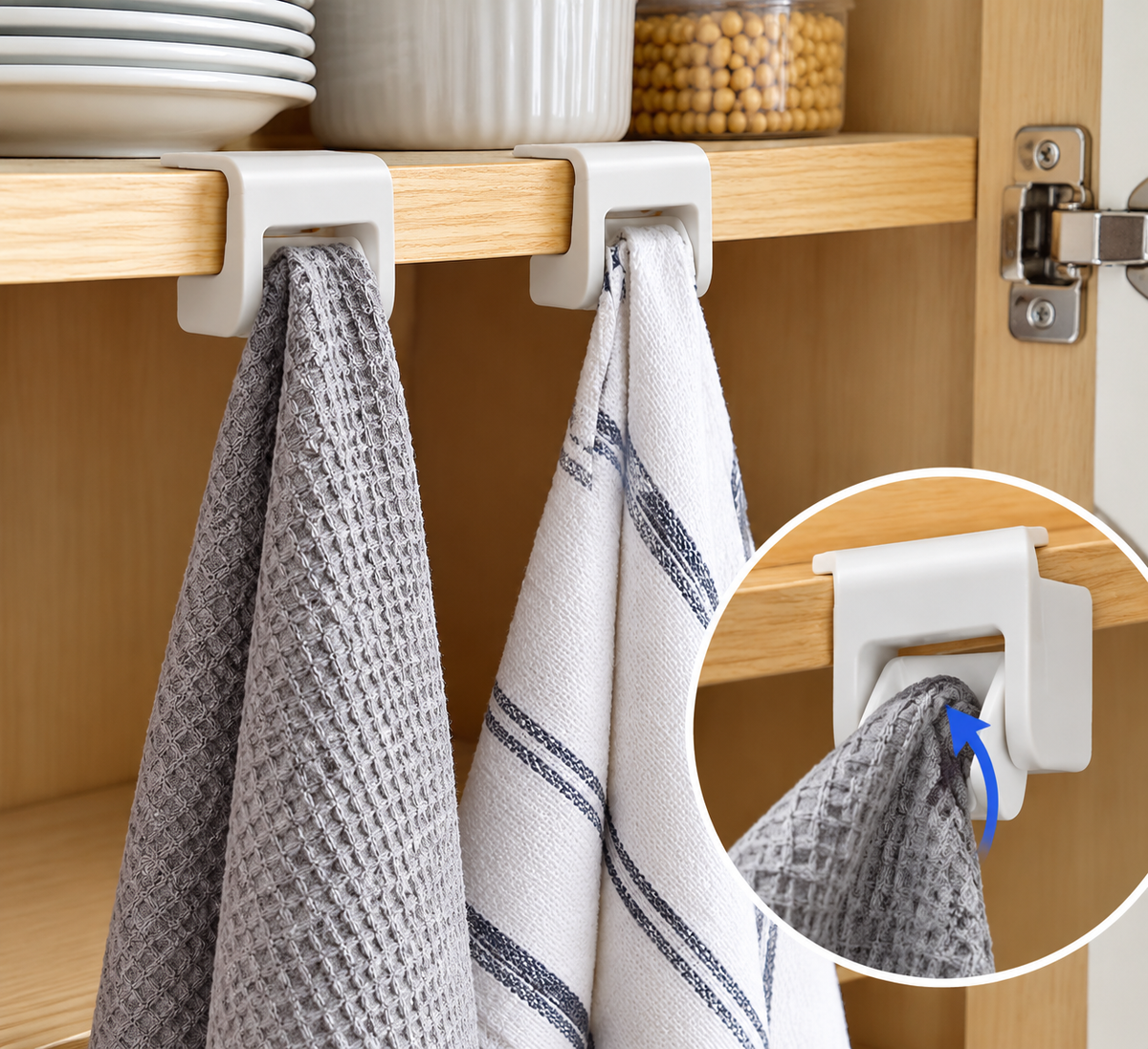 White cabinet storage clips holding kitchen towels beneath a wooden shelf